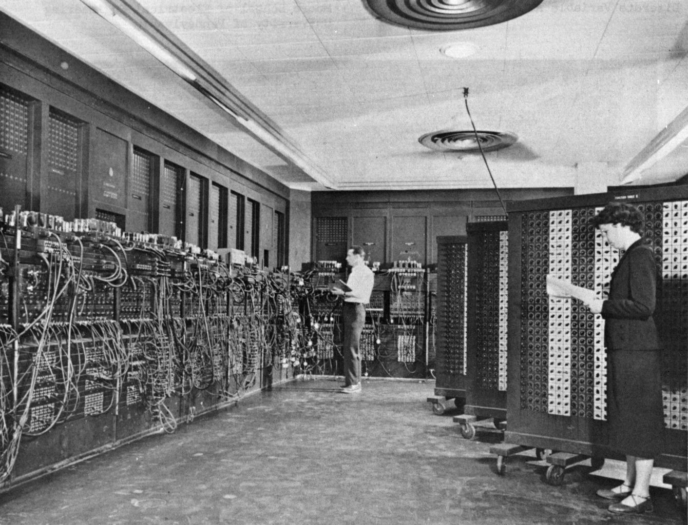 ENIAC in Philadelphia, Pennsylvania. Glen Beck and Betty Snyder program the ENIAC at the Ballistic Research Laboratory (BRL). Ca. 1945-1955. U.S. Army Photo, public domain, Wikimedia Commons