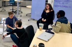 Students in the STS Futures Lab bond and engage in a spontaneous STS-inflected discussion while putting together cabinets for the Lab space